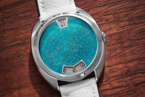 Century Paillonné Jumping Hours "Golden Snow Emerald"